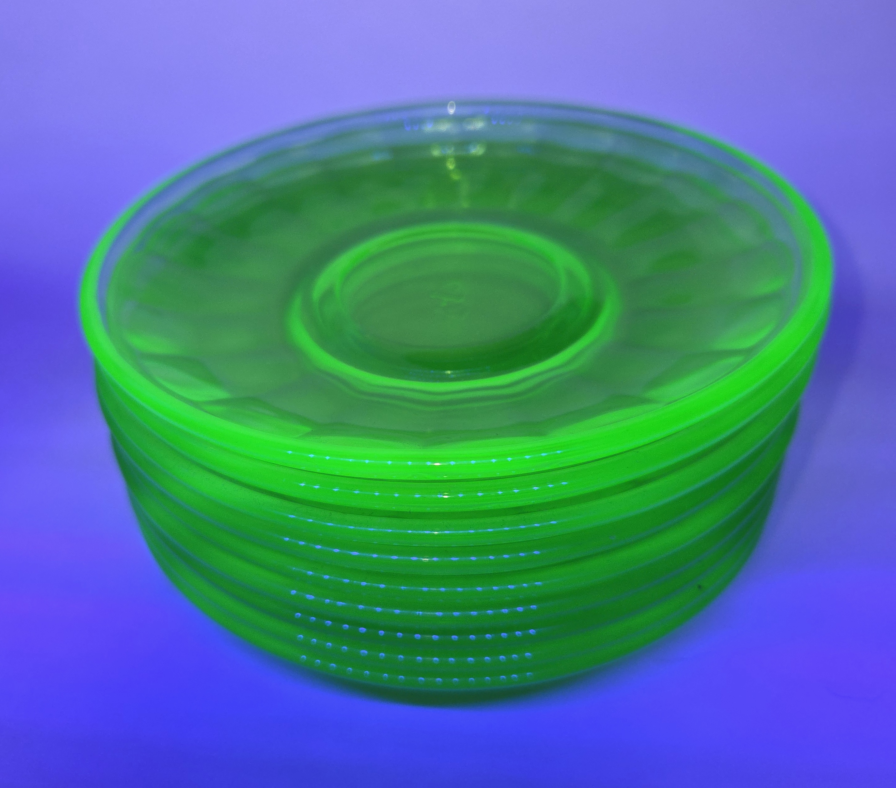 Saucers Glowing Under UV Light